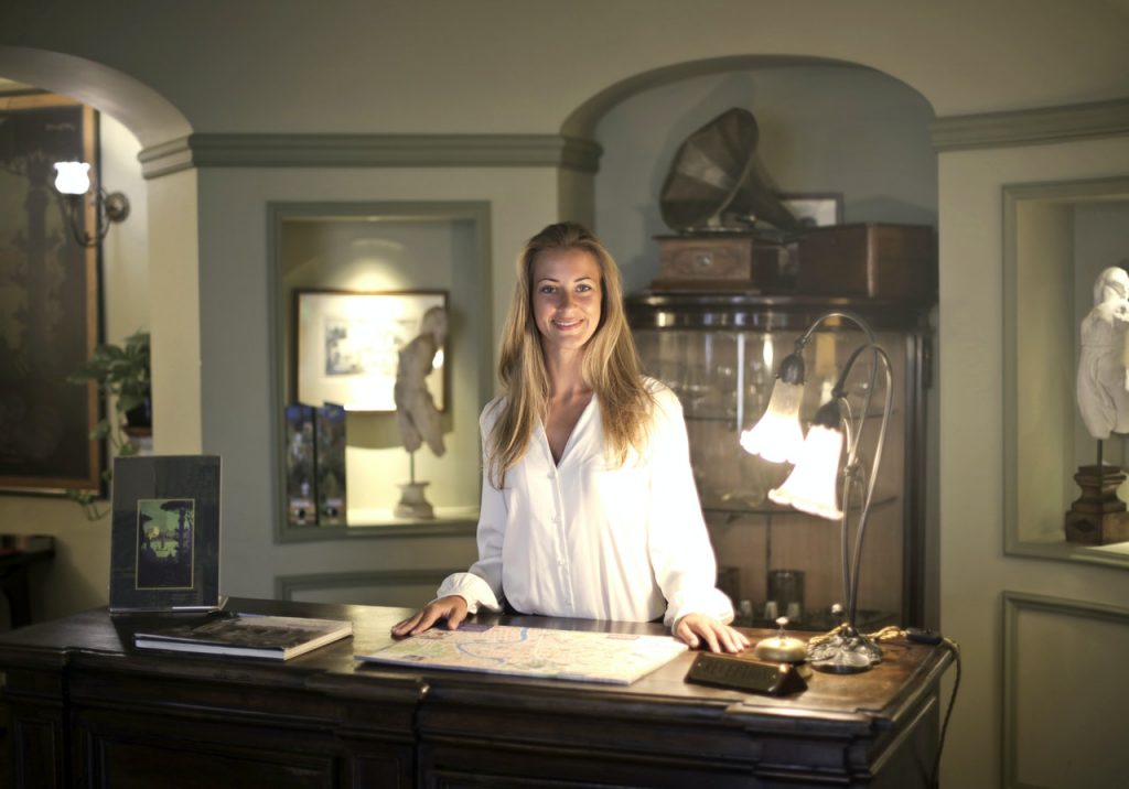 woman front desk hotel