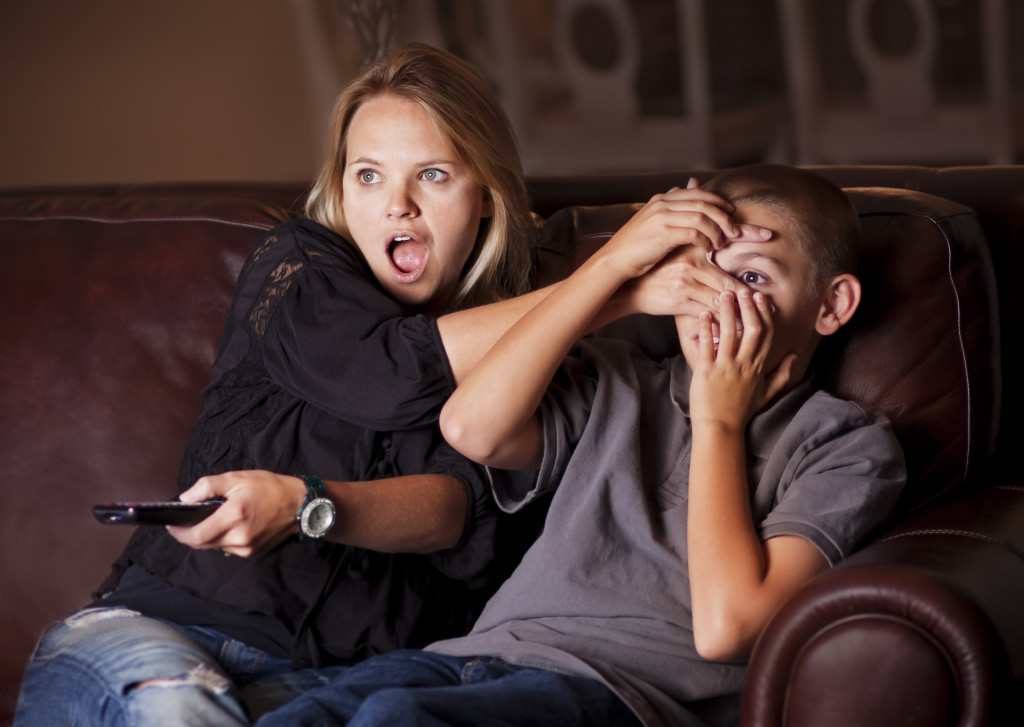 two people watching a movie together