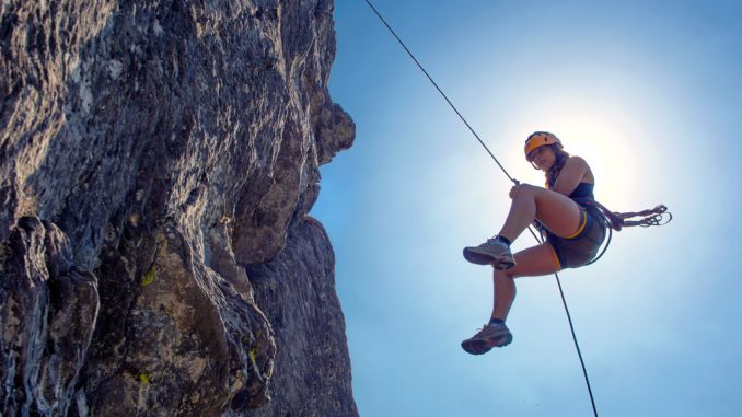 woman rock climbing