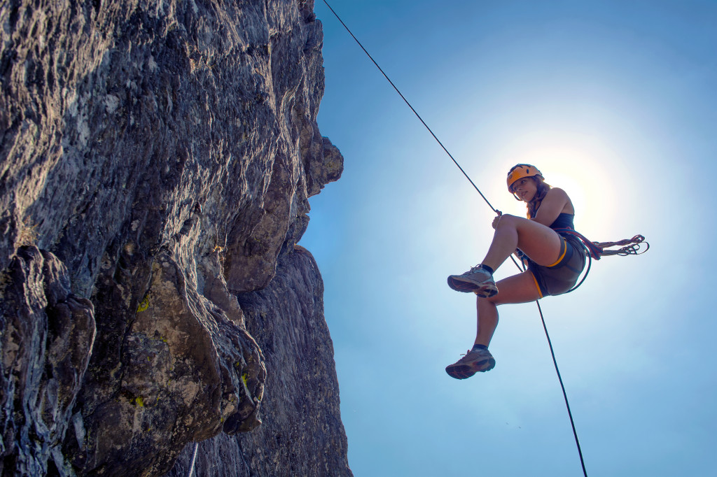 woman rock climbing