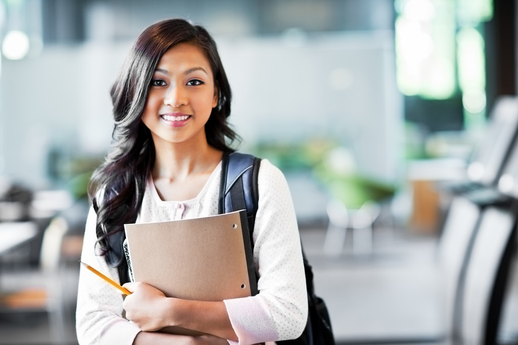 asian student going to class