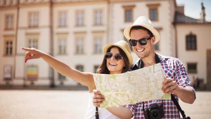 couple looking at the map while travelling