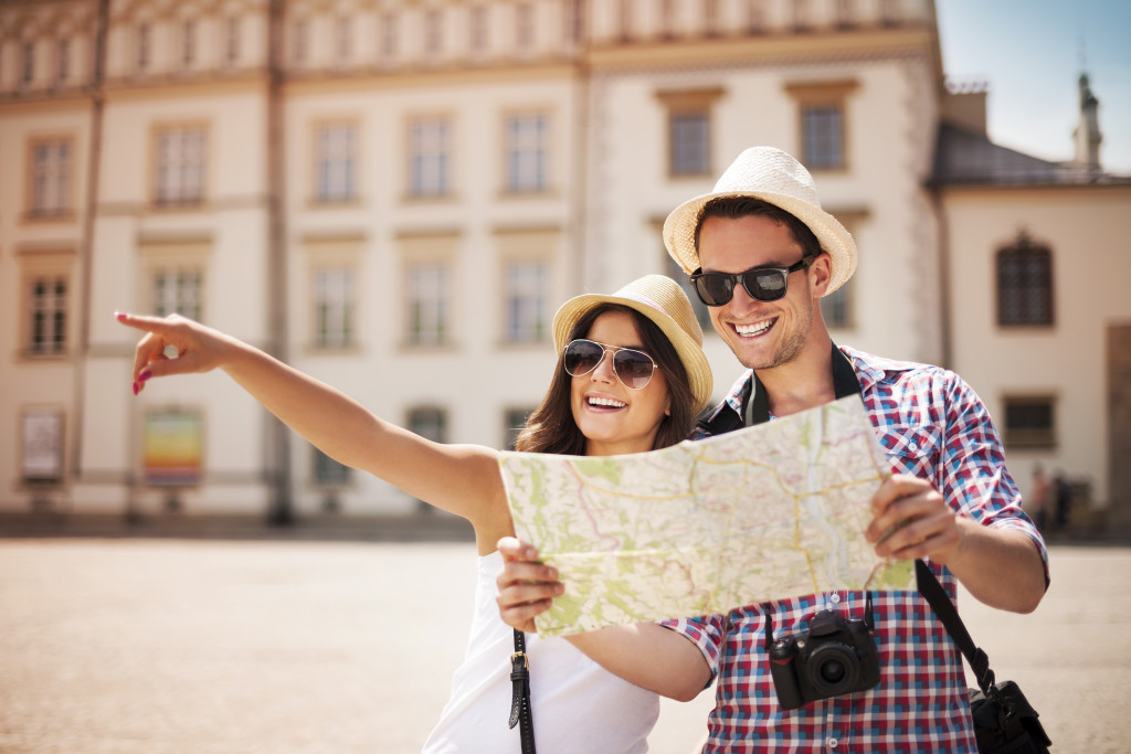 couple looking at the map while travelling